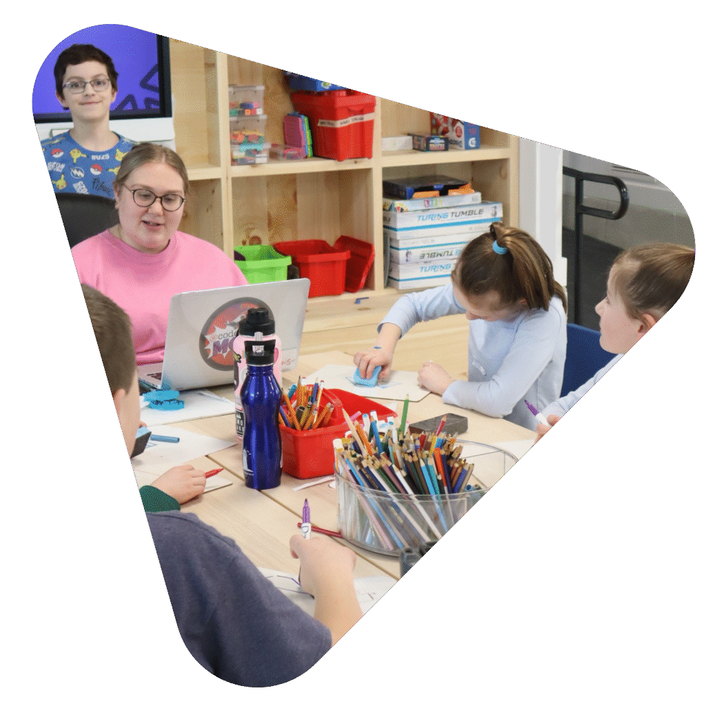 Ampere educator teaching an art lesson to students in the Makerspace